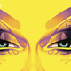 Elaborately made-up eyes and dramatic eyebrows adorn the yellow cover of Grant Morrison's novel, Luda.